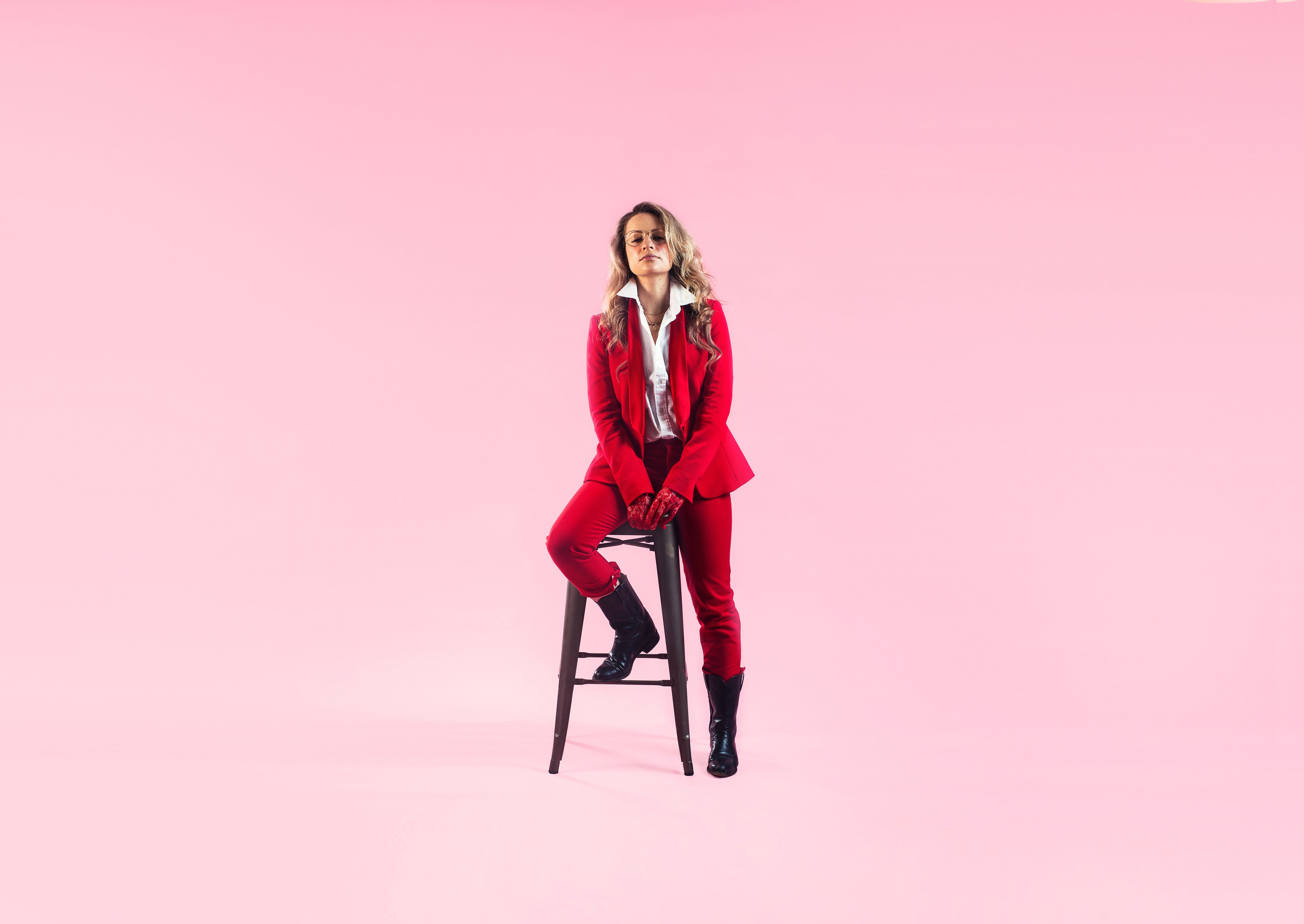woman-in-red-perches-on-stool.jpg